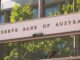 Entrance sign of the Reserve Bank of Australia on a sunny day.