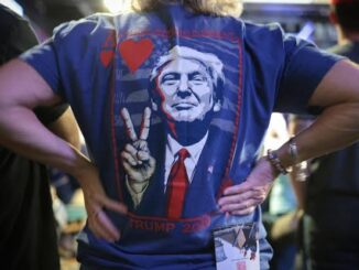 Person wearing shirt with political print design.