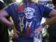 Person wearing shirt with political print design.