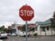 Stop sign on a suburban street corner.
