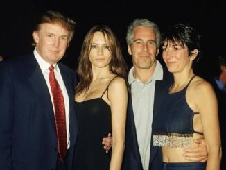 Four people posing together at an event.