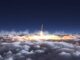Rocket launching through clouds at night.