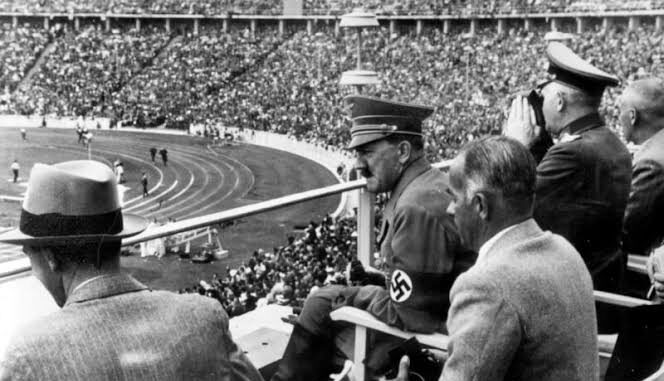 Spectators watching a stadium event, historical scene. Spectators watching a stadium event, historical scene.