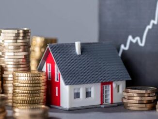 Coins, house model, rising graph background.