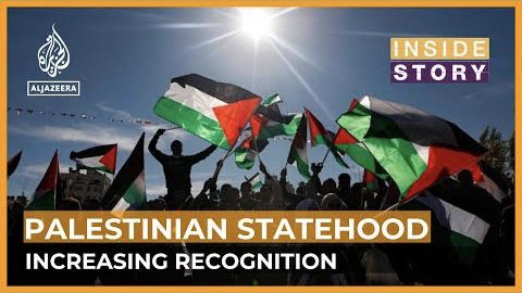People waving Palestinian flags under bright sun. People waving Palestinian flags under bright sun.
