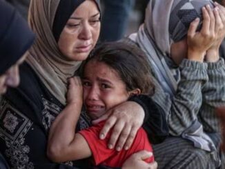 Woman comforting crying child, others in distress.