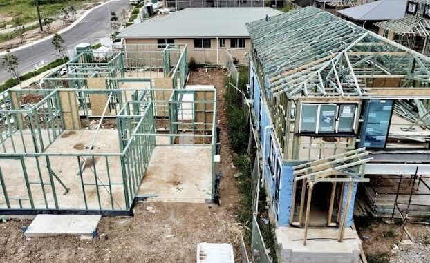 Construction site with partially built houses. Construction site with partially built houses.
