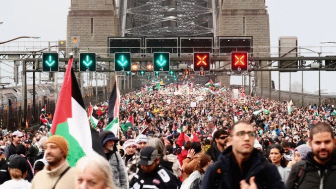 Crowd with flags on a busy bridge. Crowd with flags on a busy bridge.