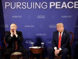 Two men seated at "Pursuing Peace" event.