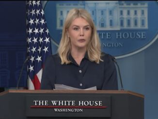 Woman speaking at White House press podium.