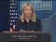 Woman speaking at White House press podium.