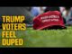 Red hat on grass, "Trump voters duped.