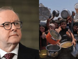 Man in suit and people holding pots.