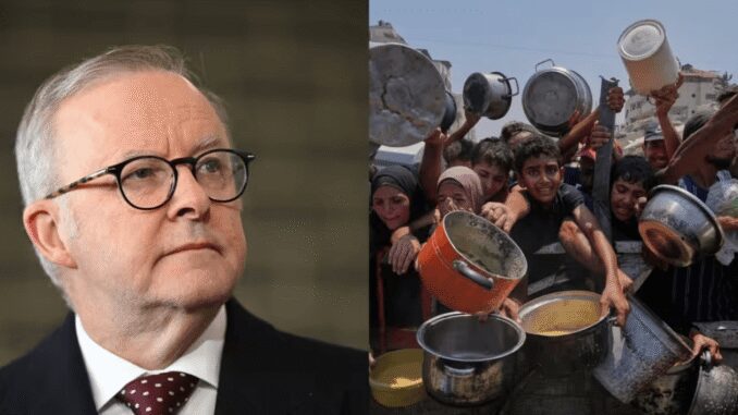 Man in suit and people holding pots.