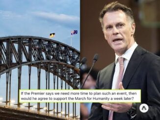 Bridge, man speaking, and text overlay.