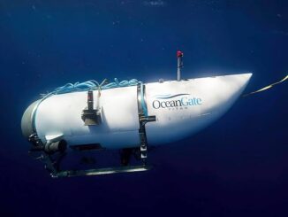 Submersible underwater with OceanGate logo visible.