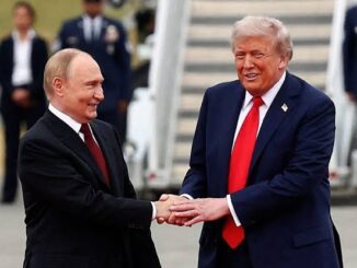 Two men shaking hands at outdoor event.