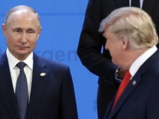 Two men in suits at a formal event.