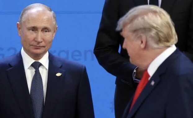 Two men in suits at a formal event. Two men in suits at a formal event.