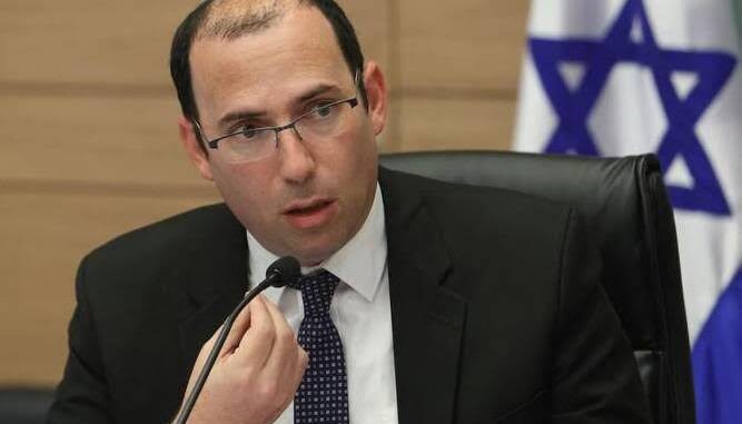 Man speaking at a meeting, Israeli flag. Man speaking at a meeting, Israeli flag.