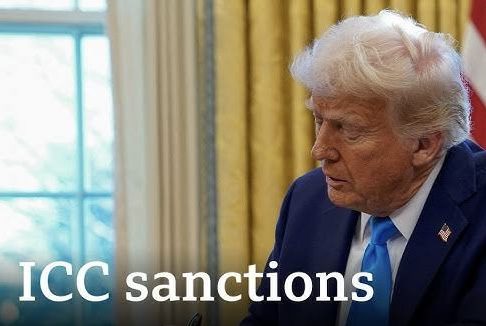 Man in suit with "ICC sanctions" text. Man in suit with "ICC sanctions" text.