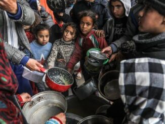 People gathering for food distribution.