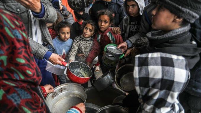 People gathering for food distribution. People gathering for food distribution.