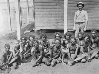 A historical photograph of chained individuals.