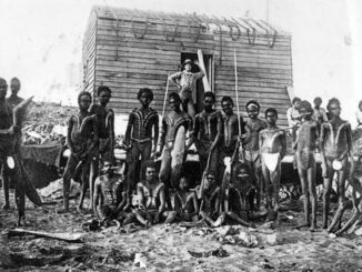 Group of indigenous people in traditional attire.