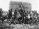Group of indigenous people in traditional attire.