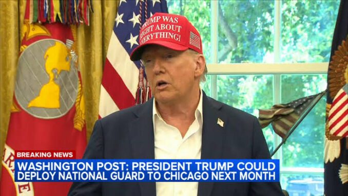 Man speaking with flags in the background. Man speaking with flags in the background.