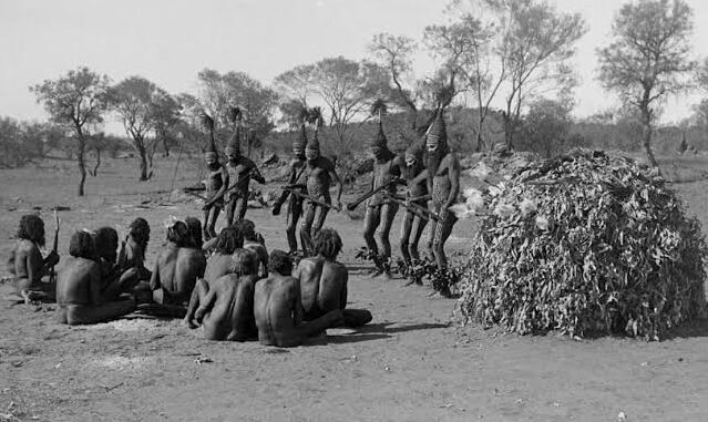 Indigenous group performing traditional dance outdoors. Indigenous group performing traditional dance outdoors.