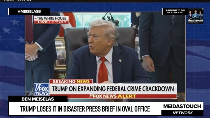 Man speaking at desk during press briefing. Man speaking at desk during press briefing.
