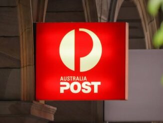 Australia Post sign on building exterior.