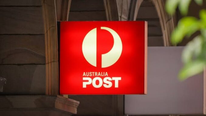 Australia Post sign on building exterior.