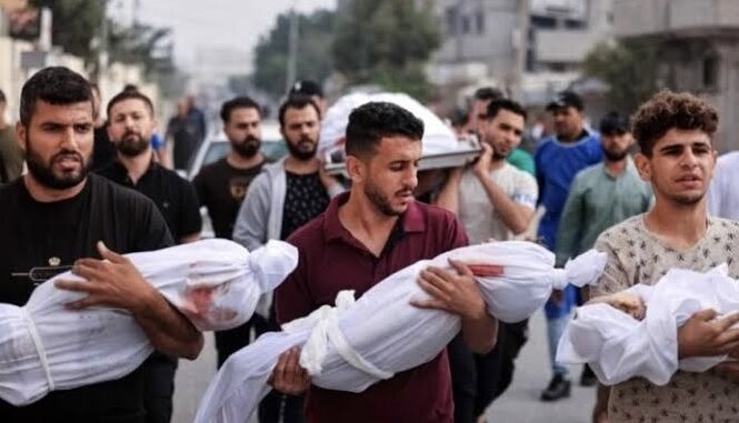 Men carrying wrapped bodies in a procession. Men carrying wrapped bodies in a procession.
