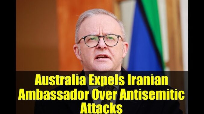 Man speaking, headline about diplomatic expulsion. Man speaking, headline about diplomatic expulsion.