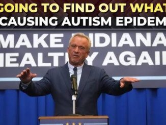 Speaker at podium with autism epidemic sign.