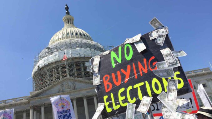 Protest sign against buying elections, Capitol backdrop. Protest sign against buying elections, Capitol backdrop.