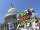 Protest sign against buying elections, Capitol backdrop.