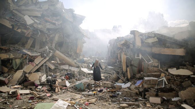 Person amidst collapsed buildings and debris. Person amidst collapsed buildings and debris.
