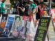 Political campaign posters displayed outdoors.