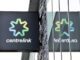 Centrelink sign with reflection on glass.