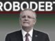 Man in suit under "Robodebt" sign.