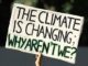 Sign reads: "The climate is changing, why aren't we?