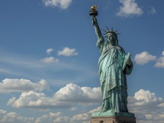 Statue of Liberty against a cloudy sky.