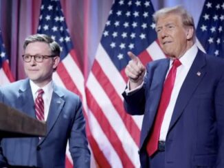 Two men in suits with American flags.