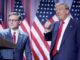 Two men in suits with American flags.
