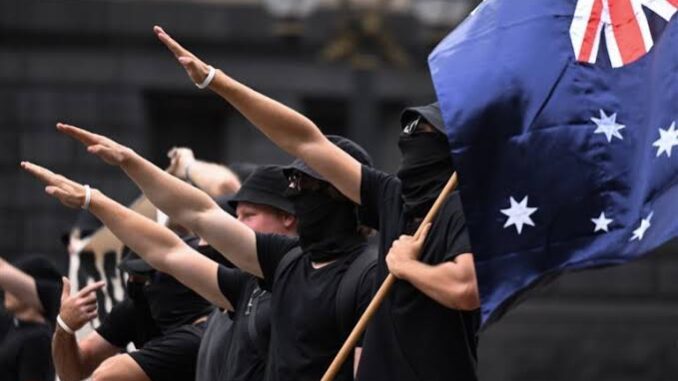 Protesters with Australian flag making salute gesture. Protesters with Australian flag making salute gesture.