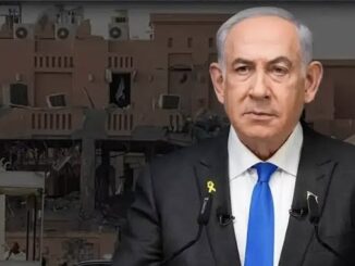 Man in suit with building background.